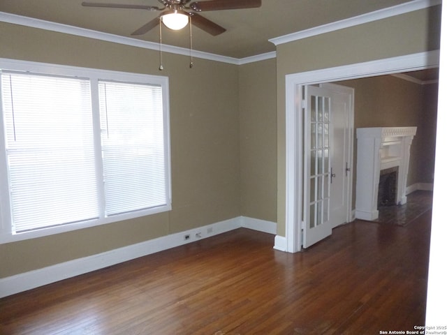 empty room featuring ceiling fan, dark hardwood / wood-style flooring, and ornamental molding