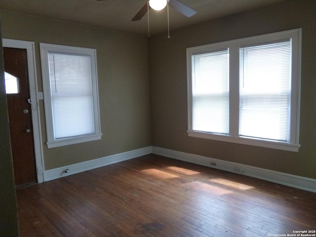 unfurnished room featuring ceiling fan and dark hardwood / wood-style floors