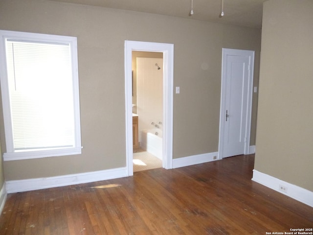 spare room with dark hardwood / wood-style floors