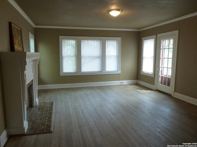 unfurnished living room with crown molding and wood-type flooring