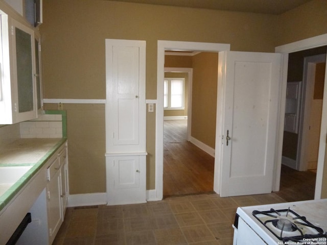 kitchen with white cabinetry and backsplash