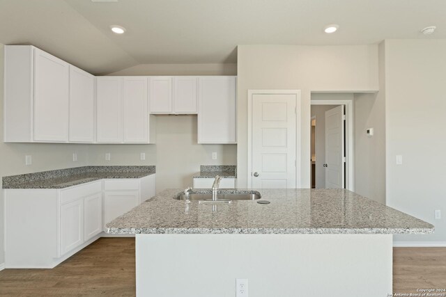1836 Charlie Cv, San Antonio, TX 78221 - kitchen with sink, a center island with sink, and white cabinets