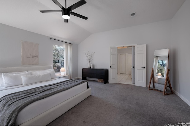 carpeted bedroom with ceiling fan, vaulted ceiling, and multiple windows