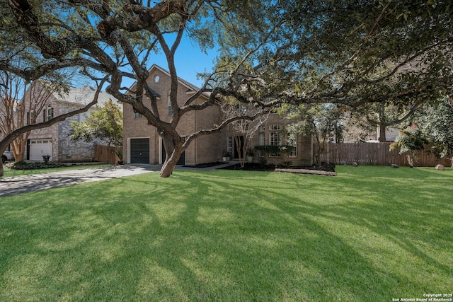 view of front of house with a garage and a front yard