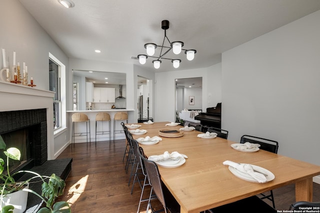 dining room featuring a notable chandelier and dark hardwood / wood-style floors