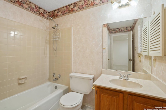 full bath with toilet, wallpapered walls, a textured ceiling, and vanity