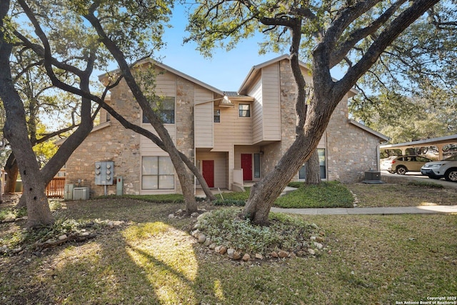 multi unit property with stone siding and central air condition unit