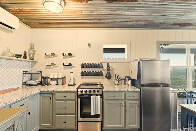 kitchen featuring a wall unit AC, open shelves, tasteful backsplash, gray cabinetry, and appliances with stainless steel finishes