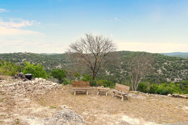 view of mountain feature featuring a view of trees