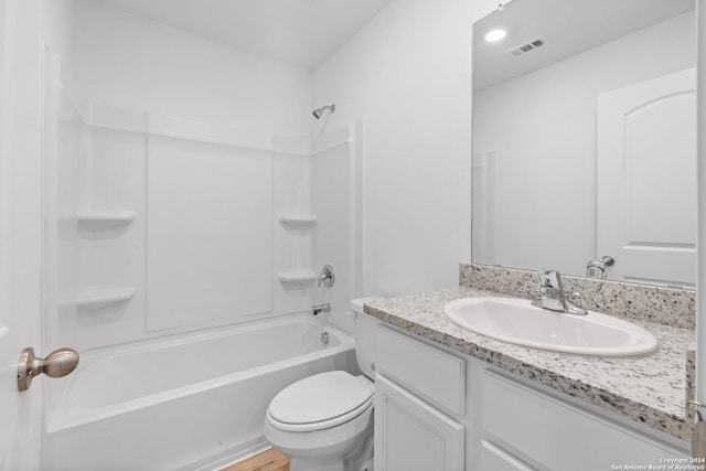 full bathroom featuring wood-type flooring, bathing tub / shower combination, vanity, and toilet