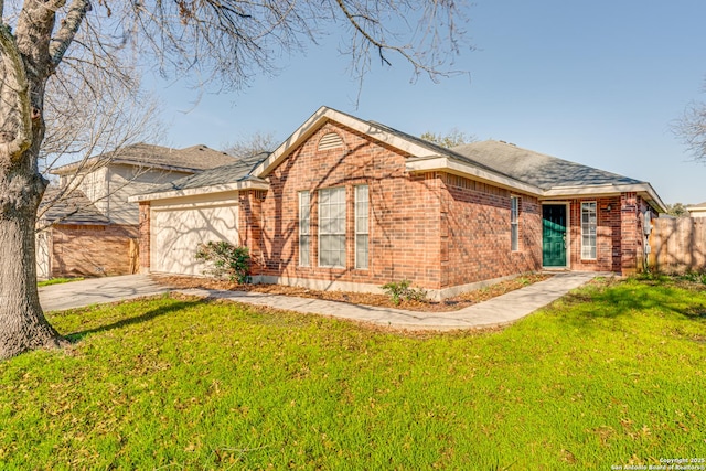 ranch-style home with a garage and a front yard