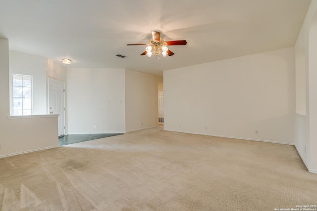 empty room featuring light carpet and ceiling fan