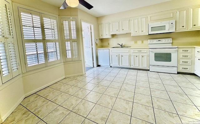 kitchen featuring white cabinetry, sink, white appliances, ceiling fan, and light tile patterned floors