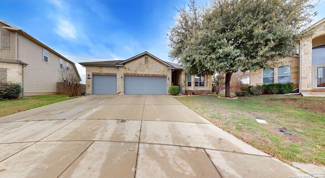 view of front of property featuring a front lawn and a garage