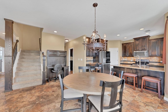 dining room featuring sink