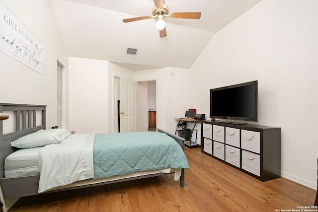 bedroom featuring lofted ceiling, ceiling fan, and wood-type flooring