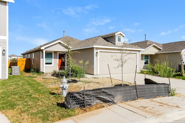 view of front of property with a garage and a front yard