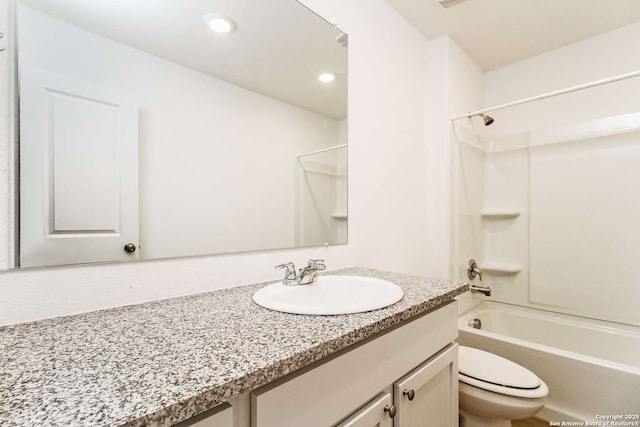 full bathroom with bathing tub / shower combination, vanity, and toilet