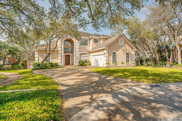 view of front of house featuring a front yard and a garage