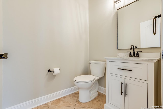 bathroom featuring vanity, toilet, and tile patterned floors