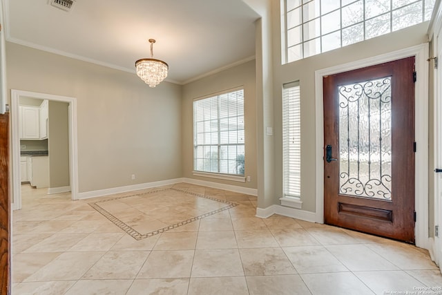 foyer featuring light tile patterned flooring, crown molding, and a notable chandelier