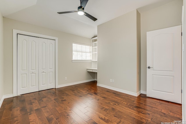 unfurnished bedroom with dark hardwood / wood-style flooring, ceiling fan, and a closet