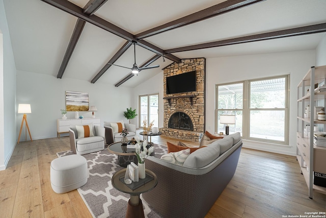 living room featuring a fireplace, ceiling fan, lofted ceiling with beams, and light hardwood / wood-style flooring