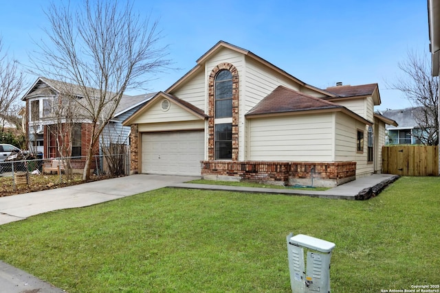 view of property with a front yard and a garage