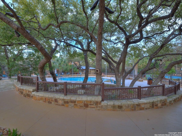 view of home's community featuring a pool