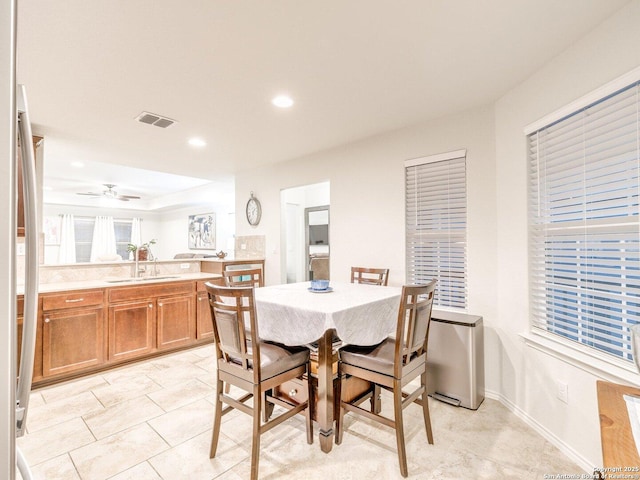 dining area featuring baseboards, visible vents, a ceiling fan, and recessed lighting