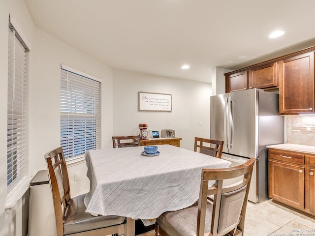 dining room with recessed lighting and light tile patterned floors