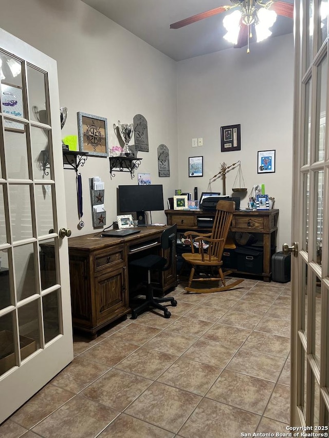 office with french doors, ceiling fan, and light tile patterned floors