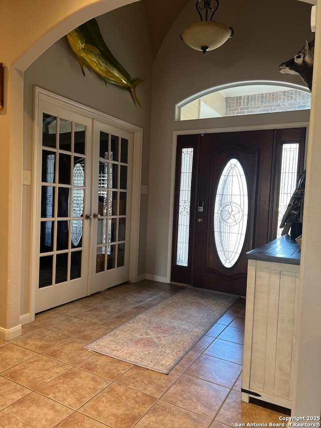 entrance foyer with french doors and light tile patterned floors