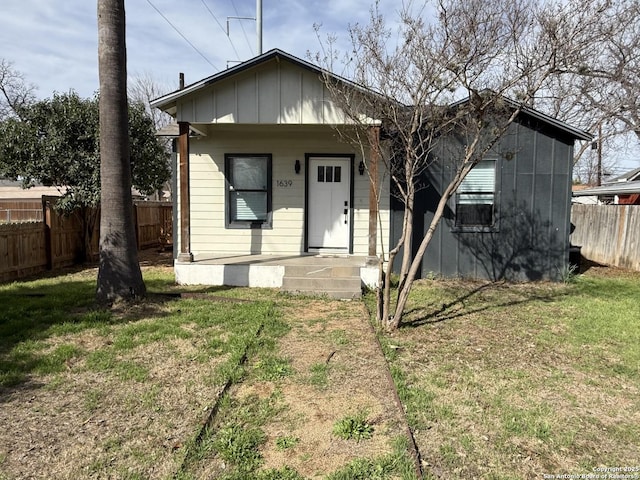 bungalow with a front lawn