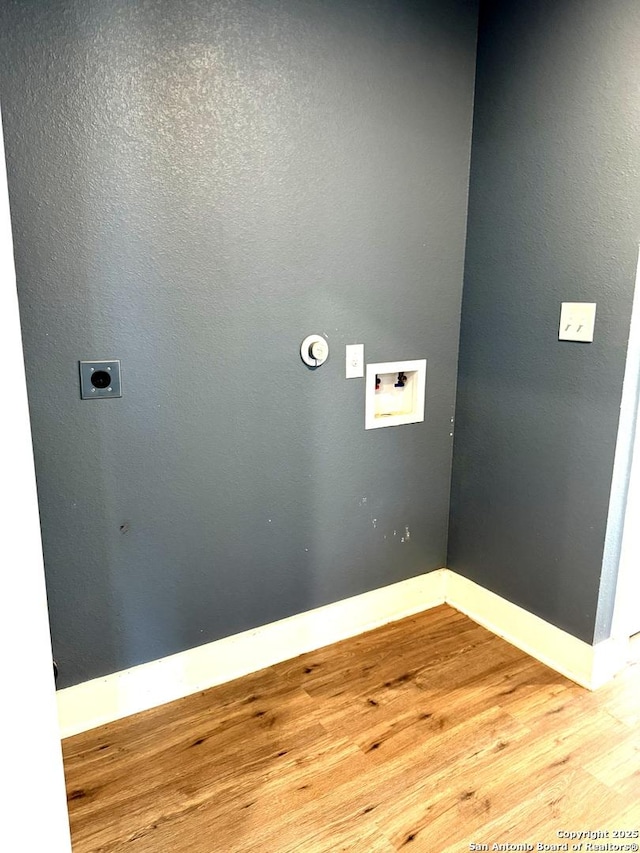 laundry area featuring light wood-type flooring, hookup for an electric dryer, and hookup for a washing machine