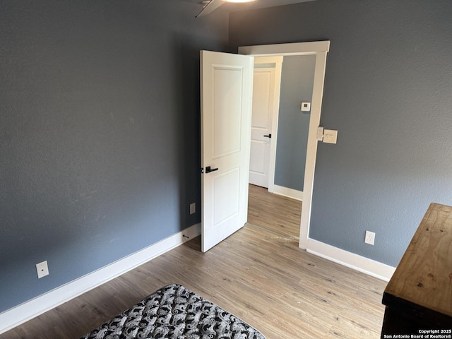 unfurnished bedroom featuring light wood-type flooring