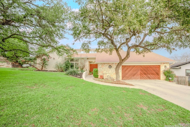 ranch-style house with a front yard and a garage