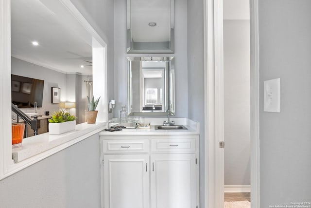 bathroom featuring vanity and crown molding