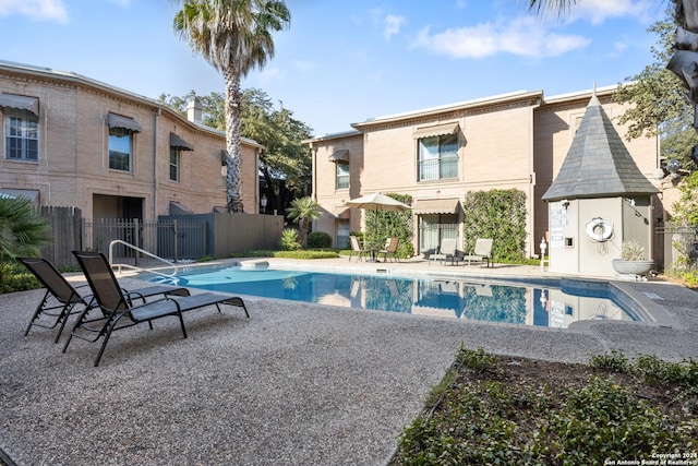 view of pool featuring a patio