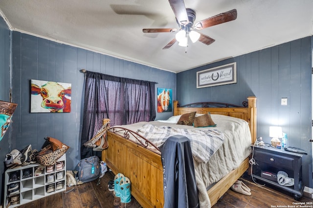 bedroom with ceiling fan and dark wood-type flooring