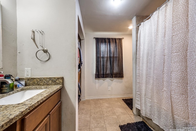 bathroom with tile patterned flooring and vanity