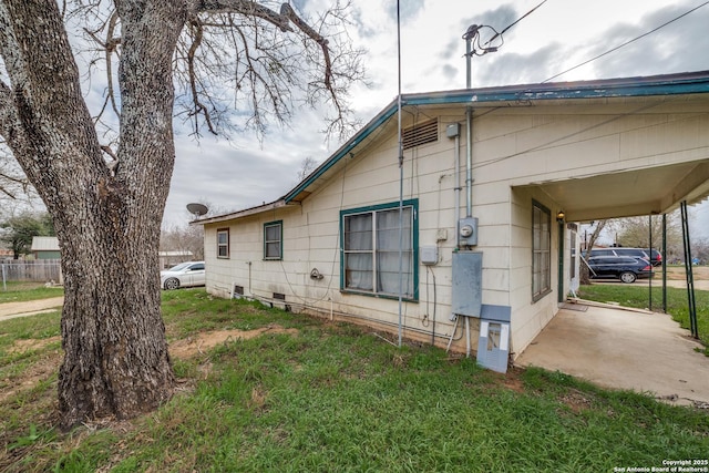 view of property exterior featuring a lawn