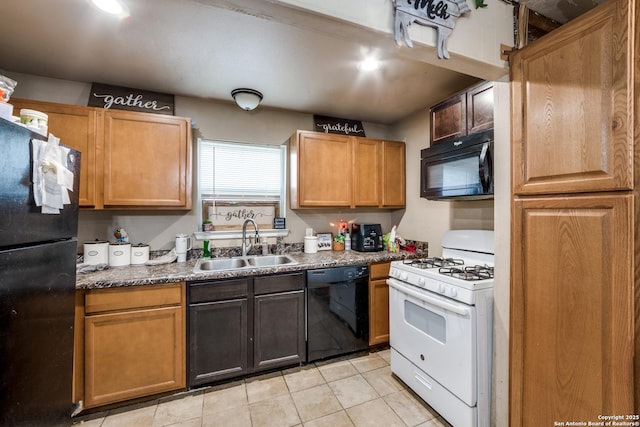 kitchen featuring sink, black appliances, and light tile patterned floors