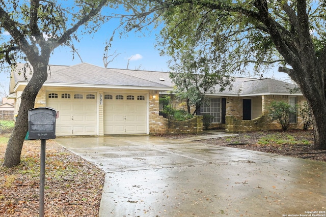 single story home featuring a garage