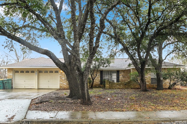 ranch-style home featuring a garage