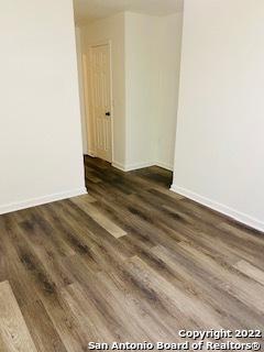 empty room featuring dark hardwood / wood-style floors