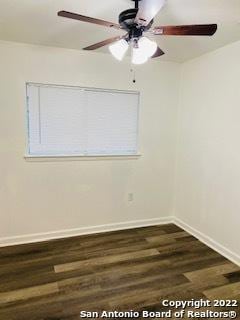 unfurnished room featuring dark wood-type flooring and ceiling fan