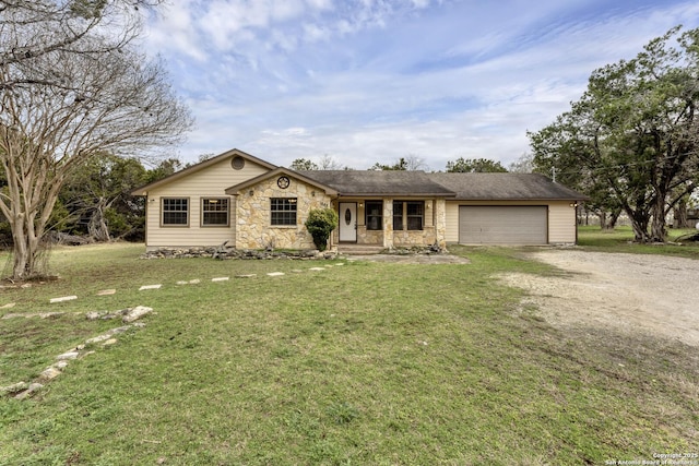 ranch-style house with a front lawn and a garage