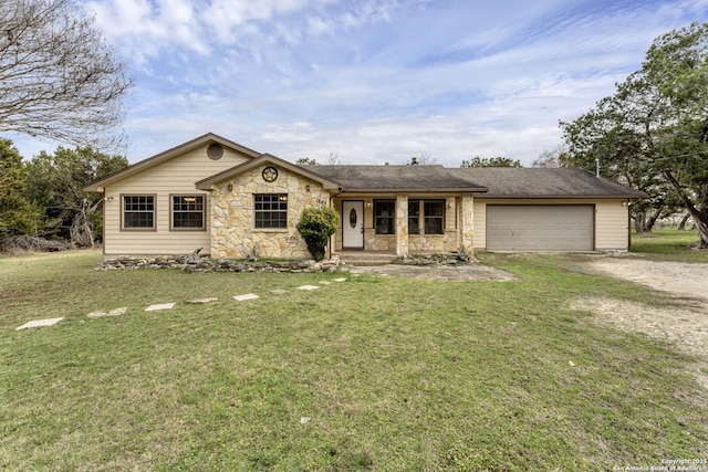 single story home with a front yard and a garage