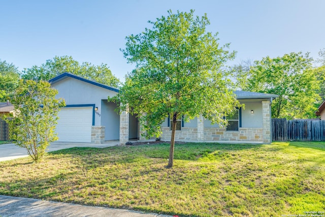 5023 Stockman Dr, San Antonio, TX 78247 - view of front of property with a garage, a front yard, fence, stone siding, and driveway